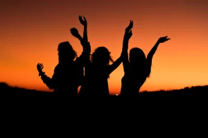 silhouettes of 3 girls during the sunset